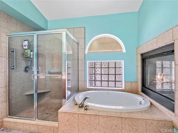 a bath tub sitting next to a window