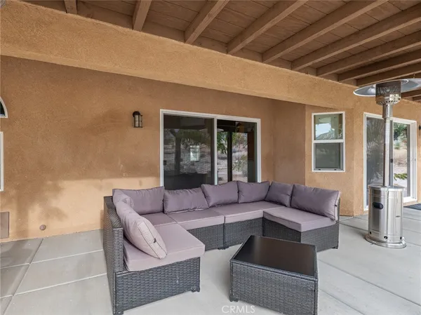 a outdoor living space with furniture and a potted plant