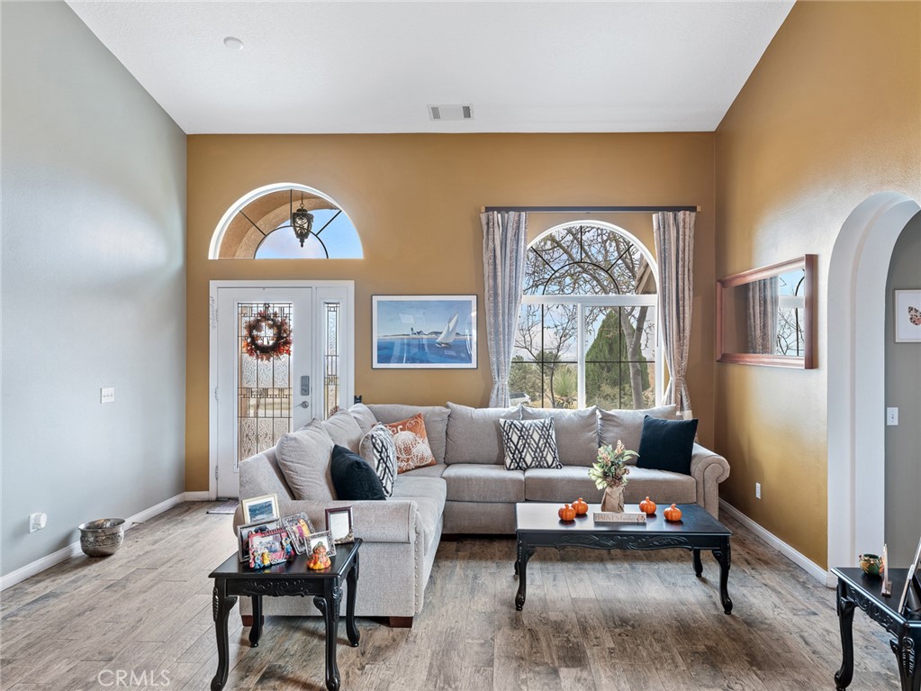 10160 Pineview Road Pinon Hills, CA 92372 - Photo 3 of 46 a living room with furniture and a large window