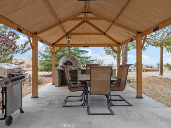 a view of a two chairs in the patio