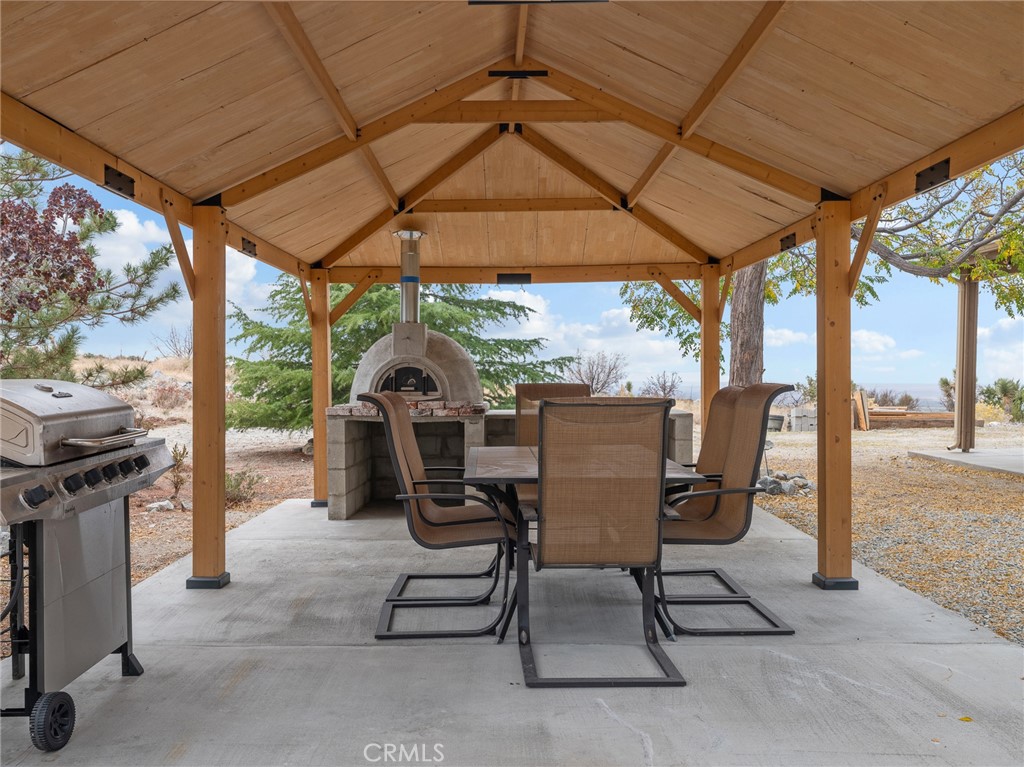 10160 Pineview Road Pinon Hills, CA 92372 - Photo 33 of 46 a view of a two chairs in the patio