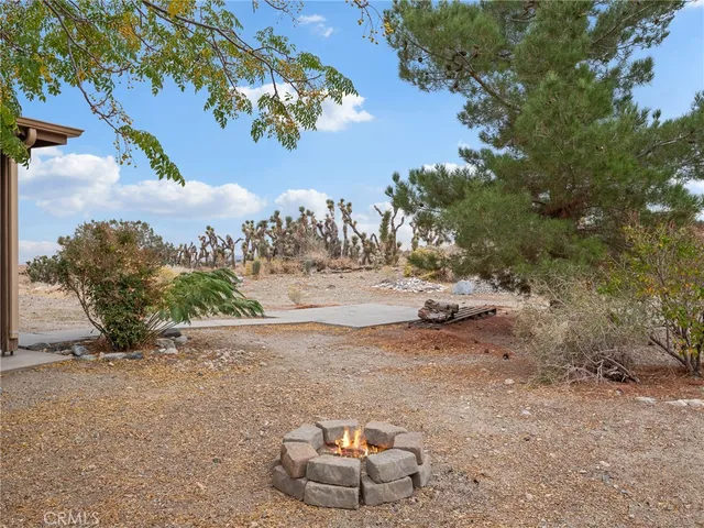 a view of a backyard of the house
