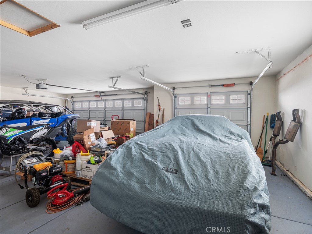 10160 Pineview Road Pinon Hills, CA 92372 - Photo 37 of 46 a bed sitting in a room next to a window