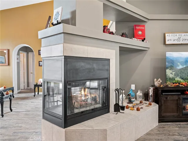 a living room with furniture and flowers