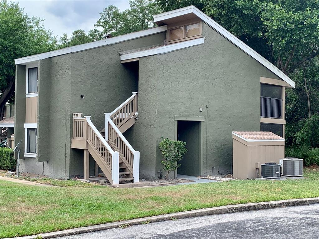 5801 Windhover Drive, Unit A01 Orlando, FL 32819 - Photo 14 of 14 a front view of house with yard