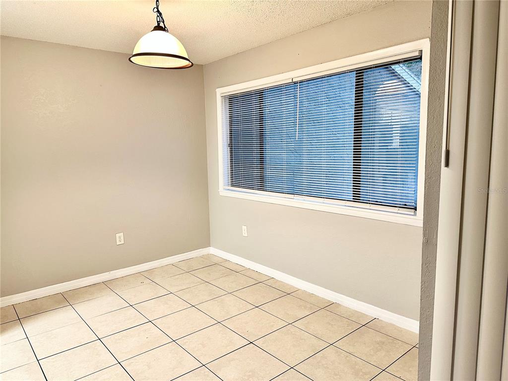 5801 Windhover Drive, Unit A01 Orlando, FL 32819 - Photo 3 of 14 a view of an empty room