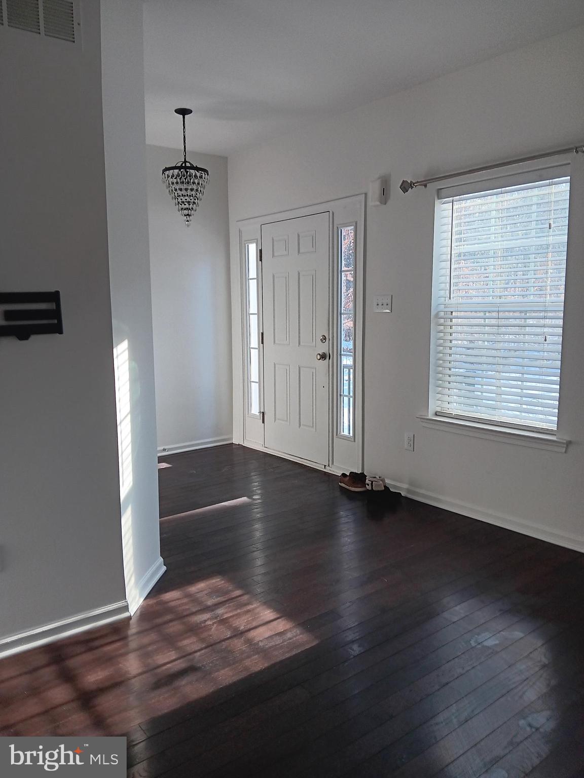 3880 Cephas Child Road, Unit 9 Doylestown, PA 18902 - Photo 2 of 18 a view of an empty room with wooden floor and a window