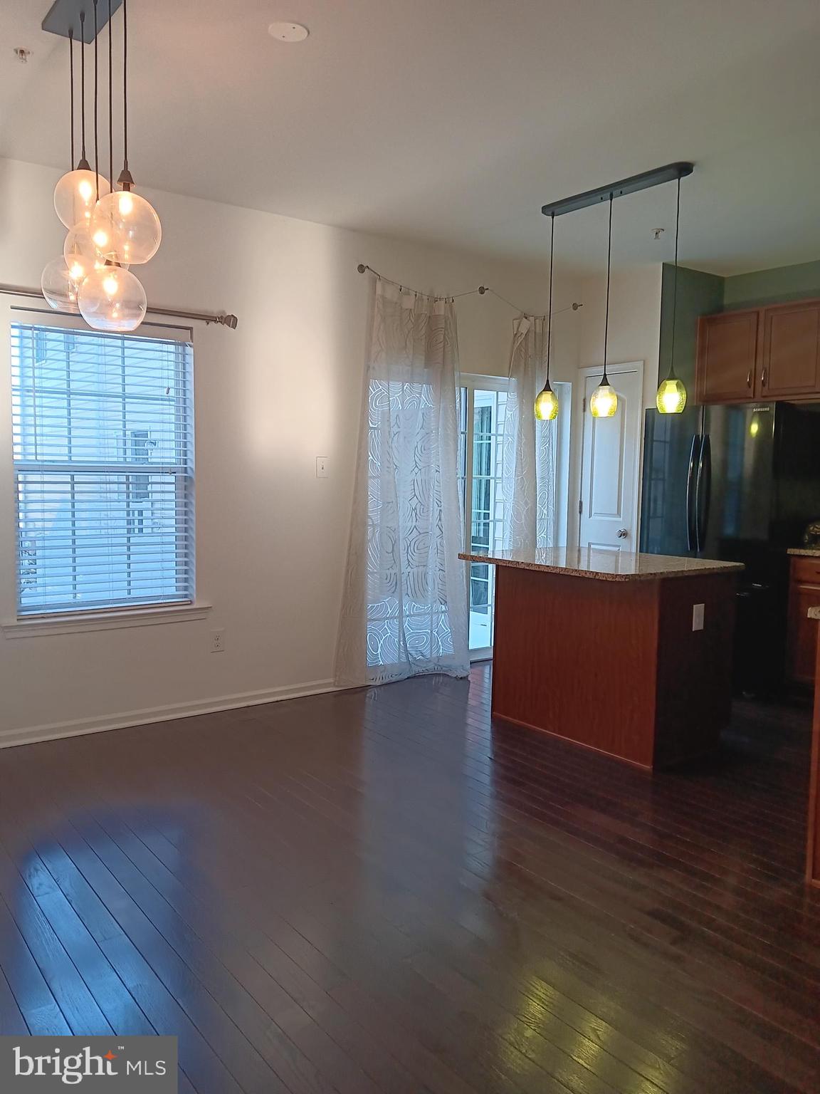 3880 Cephas Child Road, Unit 9 Doylestown, PA 18902 - Photo 4 of 18 a view of a room with wooden floor and window