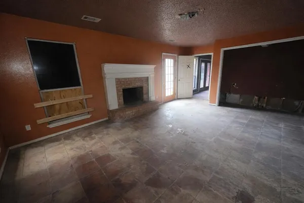 a bathroom with a granite countertop shower and a toilet