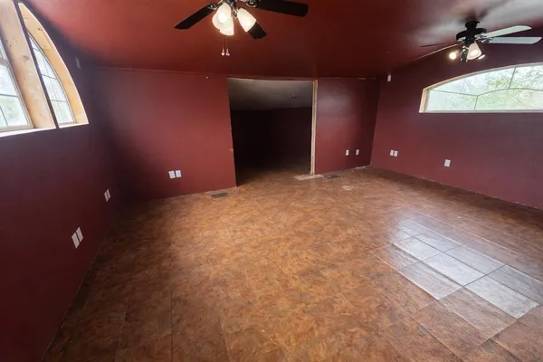 a large kitchen with stainless steel appliances a large counter top