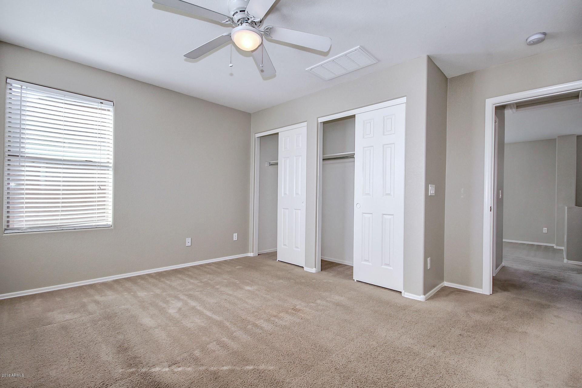 6416 West Beverly Road Laveen, AZ 85339 - Photo 11 of 22 a view of an empty room with a window