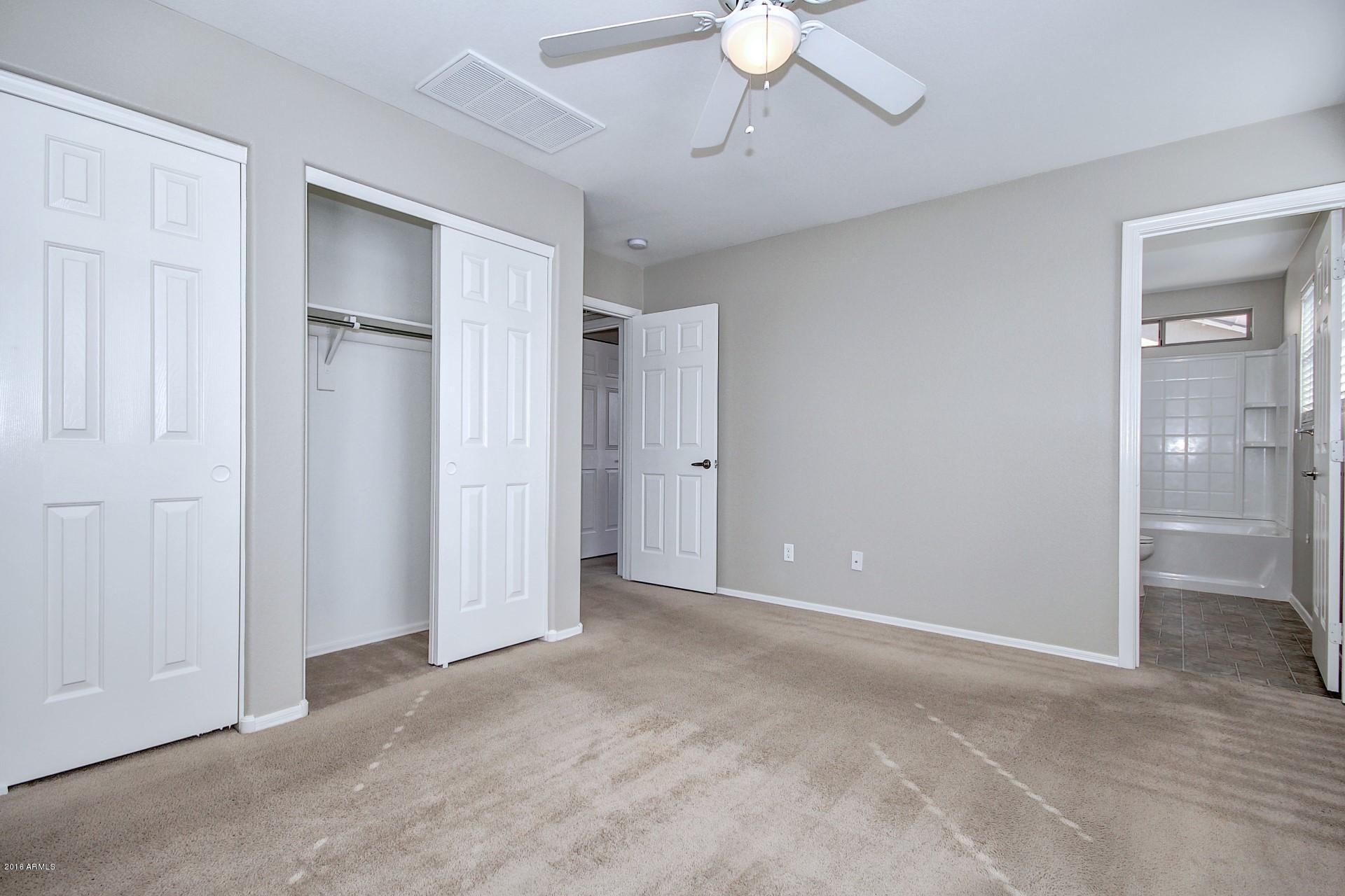 6416 West Beverly Road Laveen, AZ 85339 - Photo 12 of 22 a view of an empty room with a bathroom