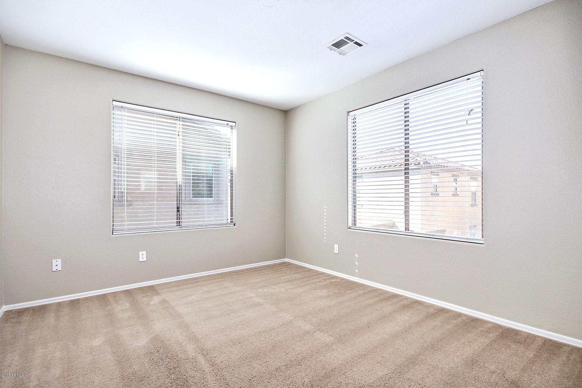 6416 West Beverly Road Laveen, AZ 85339 - Photo 16 of 22 a view of wooden floor and windows in a room