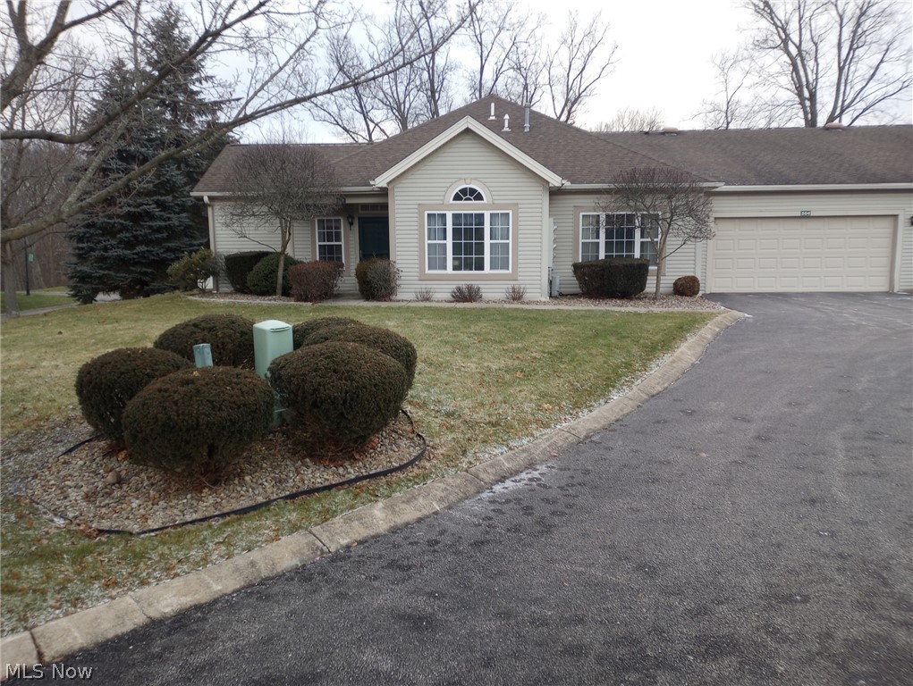 304 Wilcox Road Youngstown, OH 44515 - Photo 1 of 35 Ranch-style house with a garage and a front yard