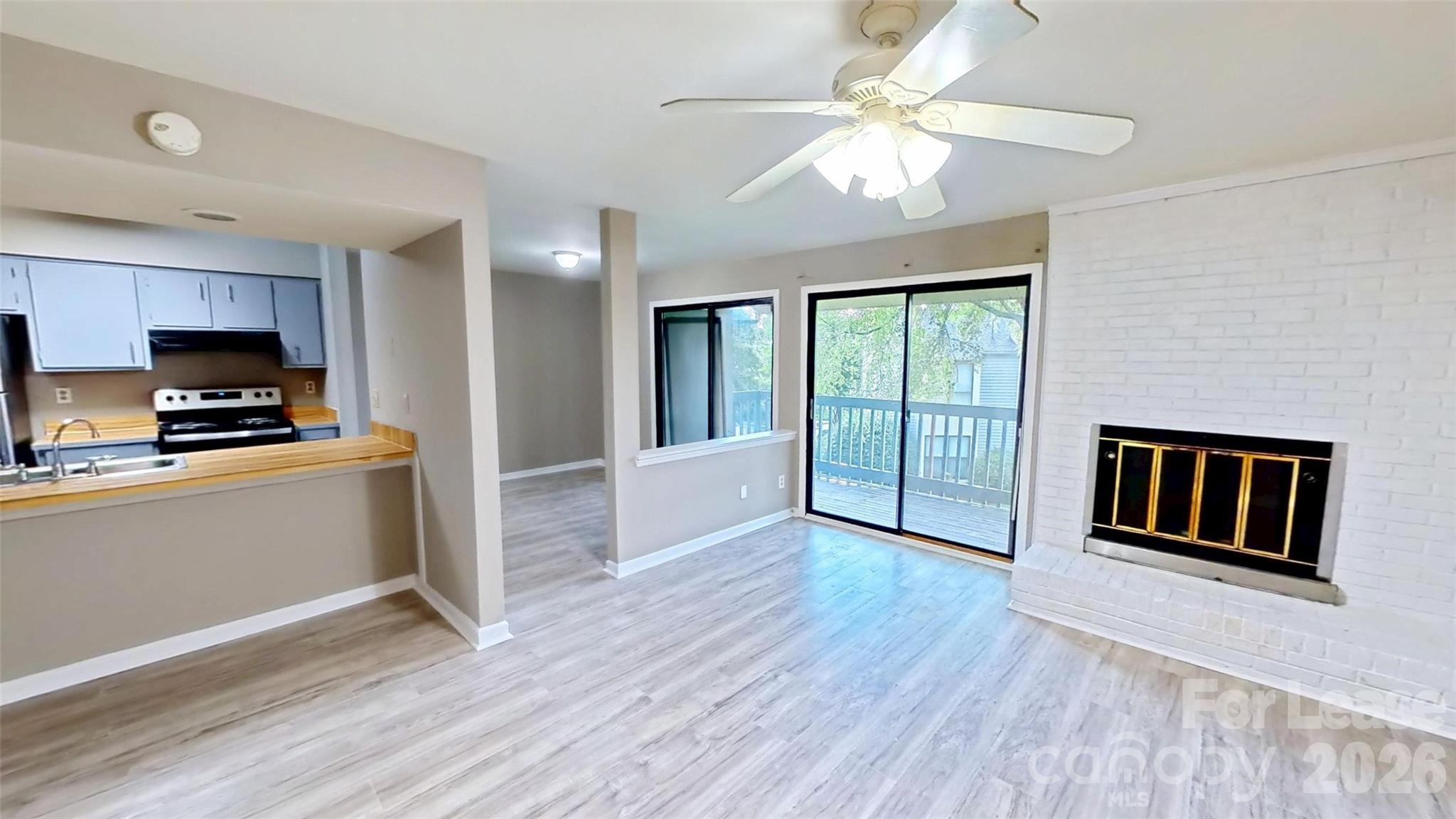 11139 Harrowfield Road Charlotte, NC 28226 - Photo 2 of 6 a view of kitchen with sink and wooden floor
