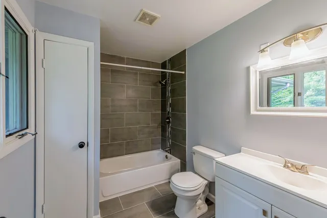 a bathroom with a sink toilet bathtub and shower