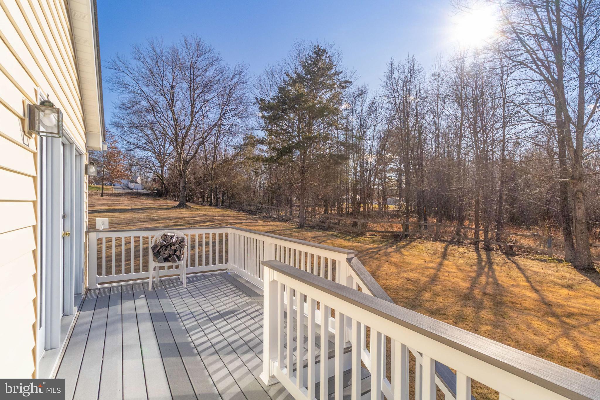 921 Palmer Road Fort Washington, MD 20744 - Photo 21 of 25 Sunny deck overlooking serene wooded landscape.