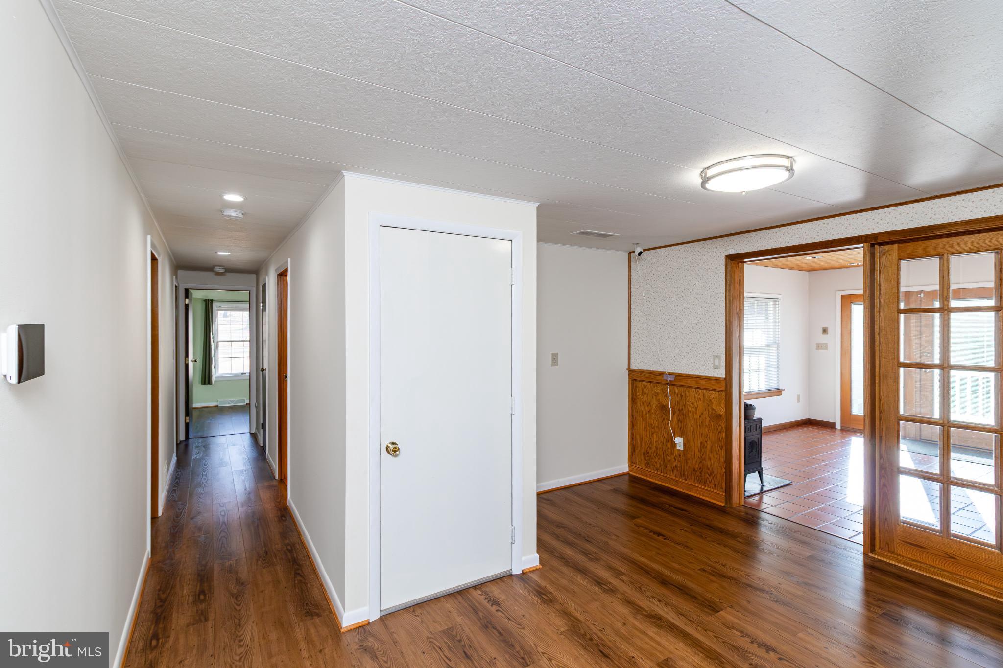 921 Palmer Road Fort Washington, MD 20744 - Photo 8 of 25 Spacious hallway with inviting natural light.