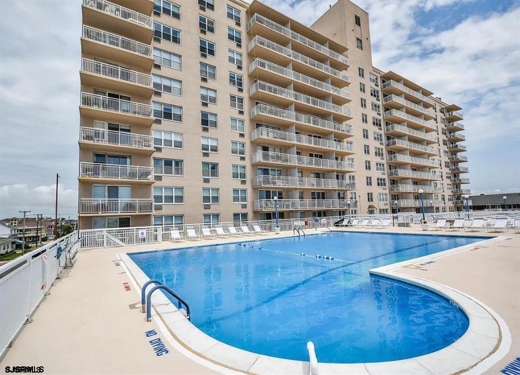 9400 Atlantic Avenue, Unit 306 Margate City, NJ 08402 - Photo 11 of 17 a view of a swimming pool with outdoor seating