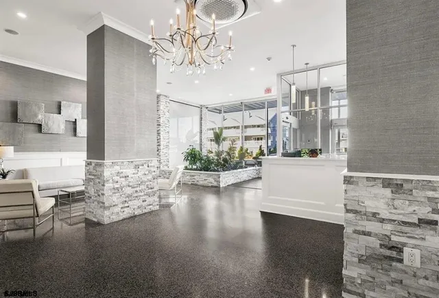 a view of a living room and chandelier