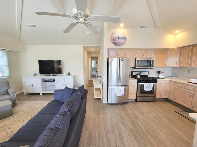 a bathroom with a granite countertop sink and a white door