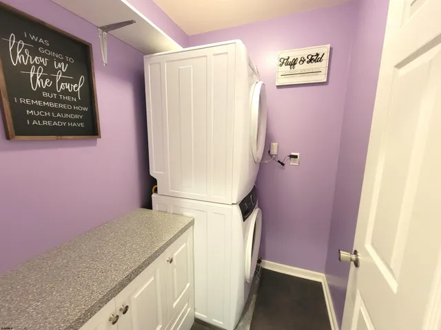 a bathroom with a toilet a sink and a large mirror