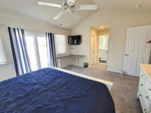 a bathroom with double vanity and a bathtub