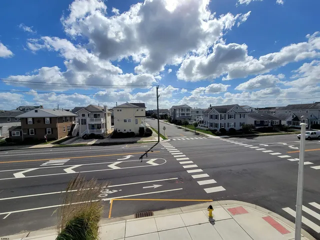 a view of a dining room with furniture and window