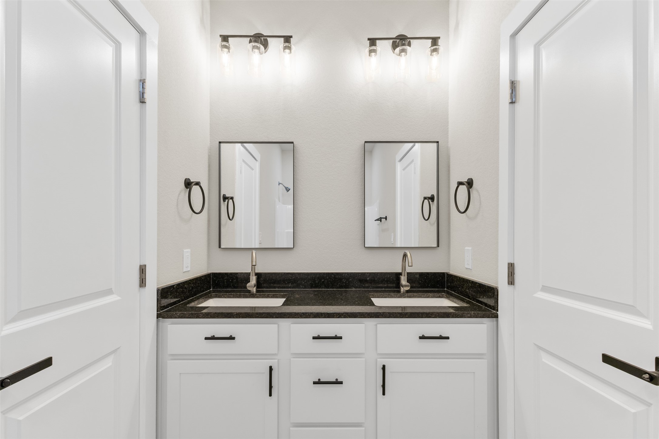 1504 Clay Street, Unit AB Brenham, TX 77833 - Photo 15 of 30 a bathroom with double sink and granite