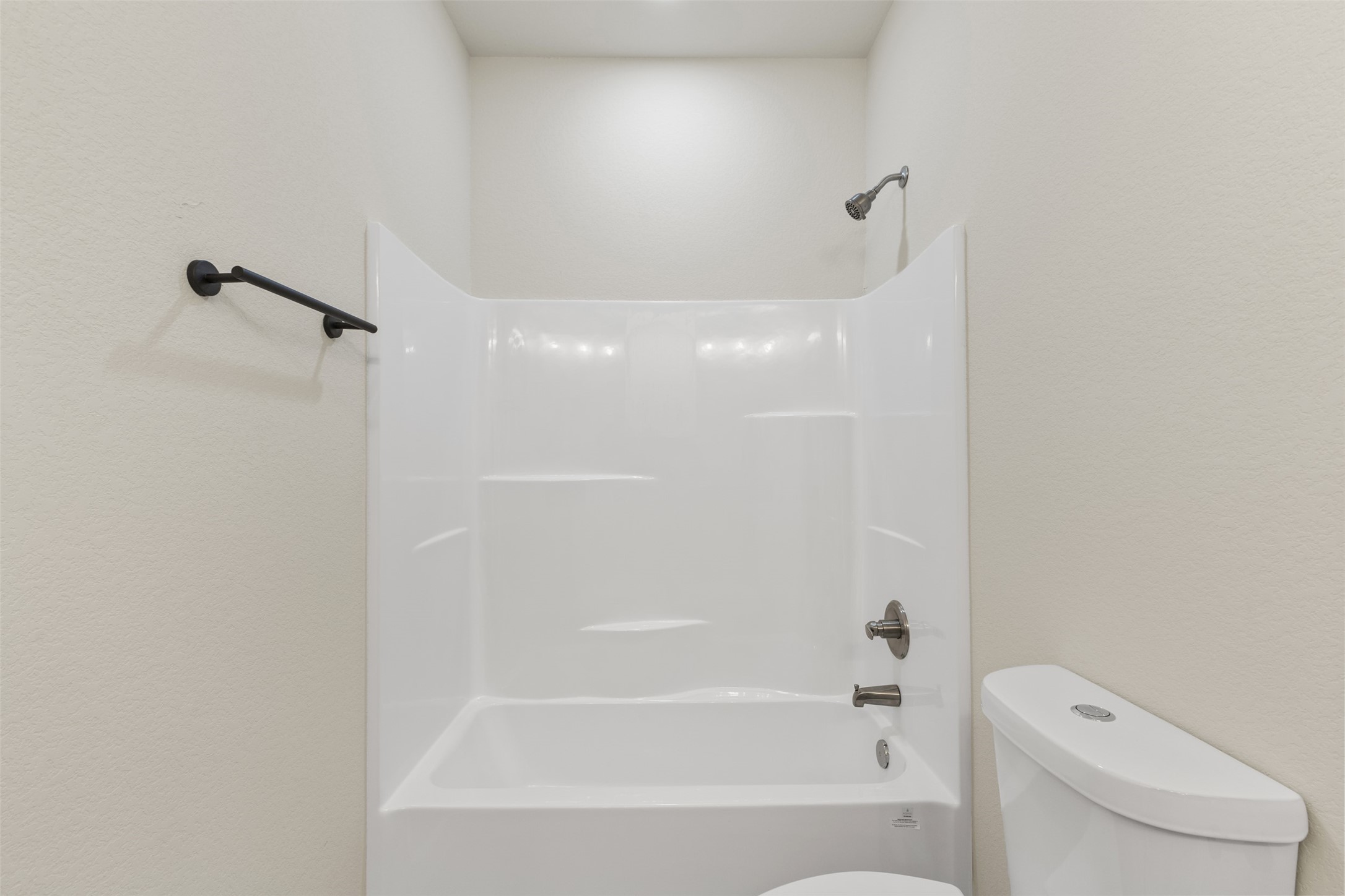 1504 Clay Street, Unit AB Brenham, TX 77833 - Photo 16 of 30 a bathroom with a bathtub and a toilet