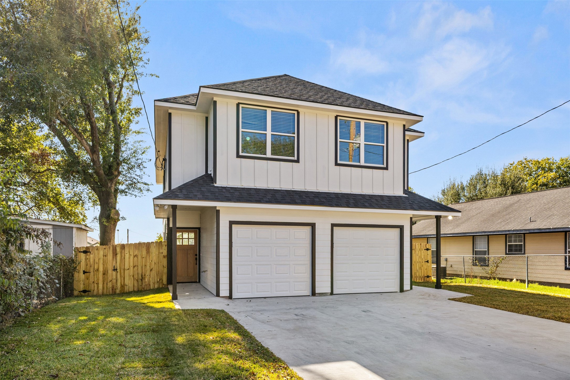1504 Clay Street, Unit AB Brenham, TX 77833 - Photo 2 of 30 a front view of a house with a yard