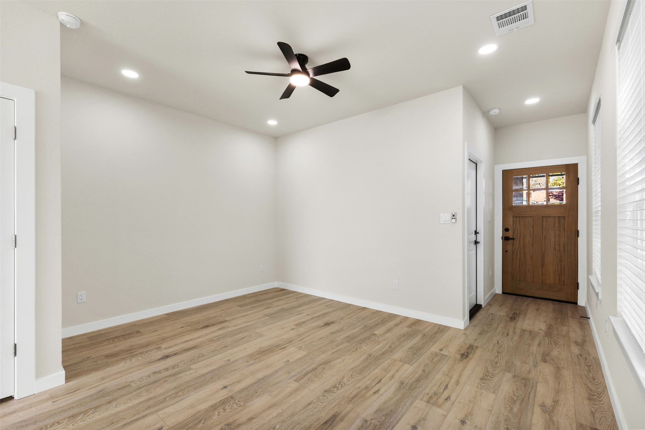 1504 Clay Street, Unit AB Brenham, TX 77833 - Photo 22 of 30 wooden floor in an empty room with a window