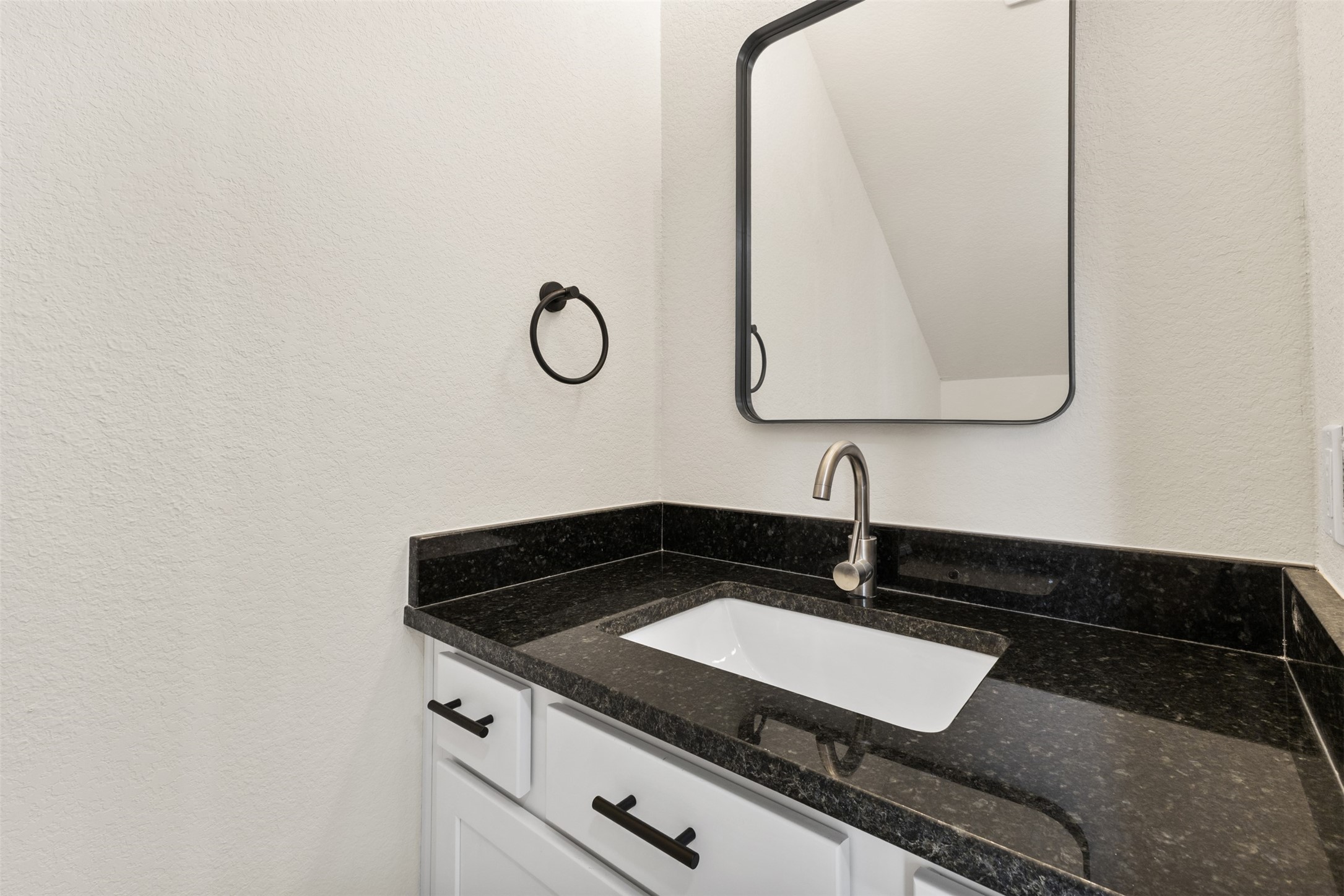 1504 Clay Street, Unit AB Brenham, TX 77833 - Photo 25 of 30 a close view of a sink and a vanity in the kitchen