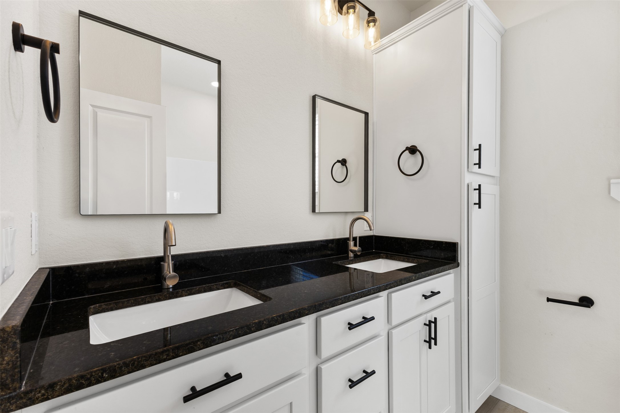 1504 Clay Street, Unit AB Brenham, TX 77833 - Photo 27 of 30 a bathroom with a sink and a mirror