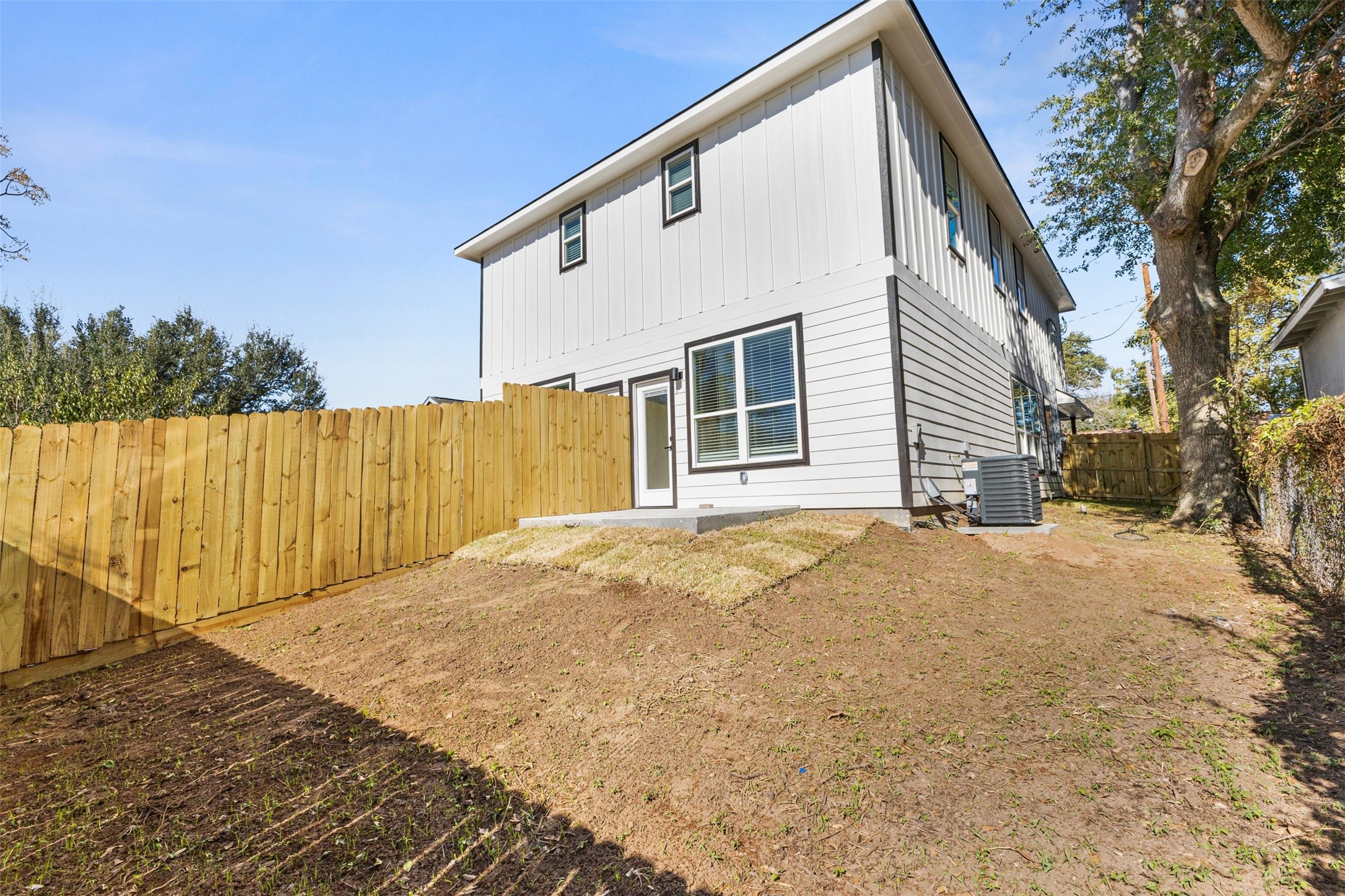 1504 Clay Street, Unit AB Brenham, TX 77833 - Photo 30 of 30 a view of a house with a backyard