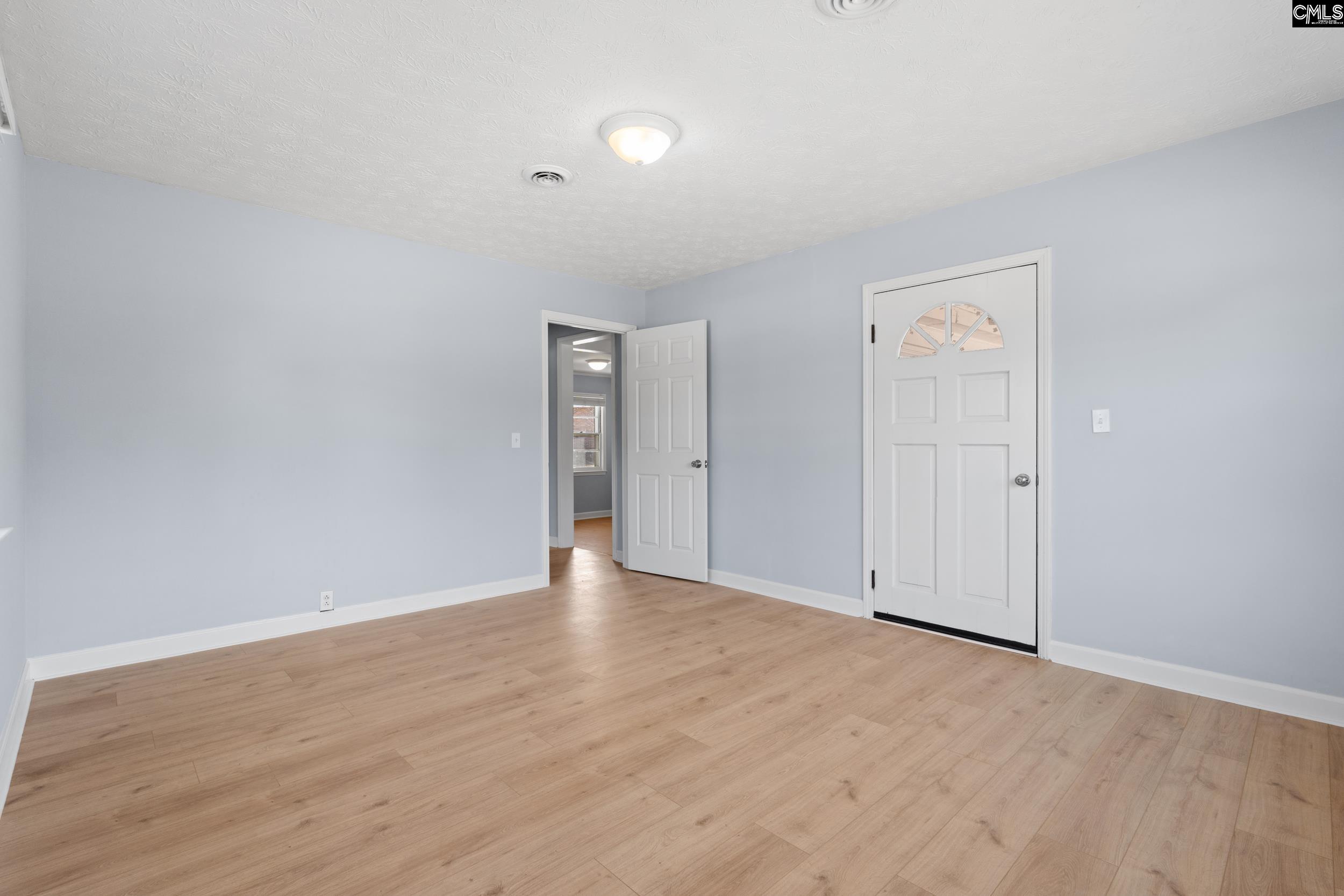 409 Wilkes Road Columbia, SC 29203 - Photo 27 of 34 a view of an empty room and wooden floor