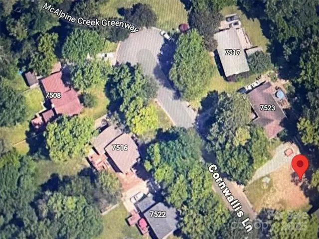 an aerial view of a house a yard and street