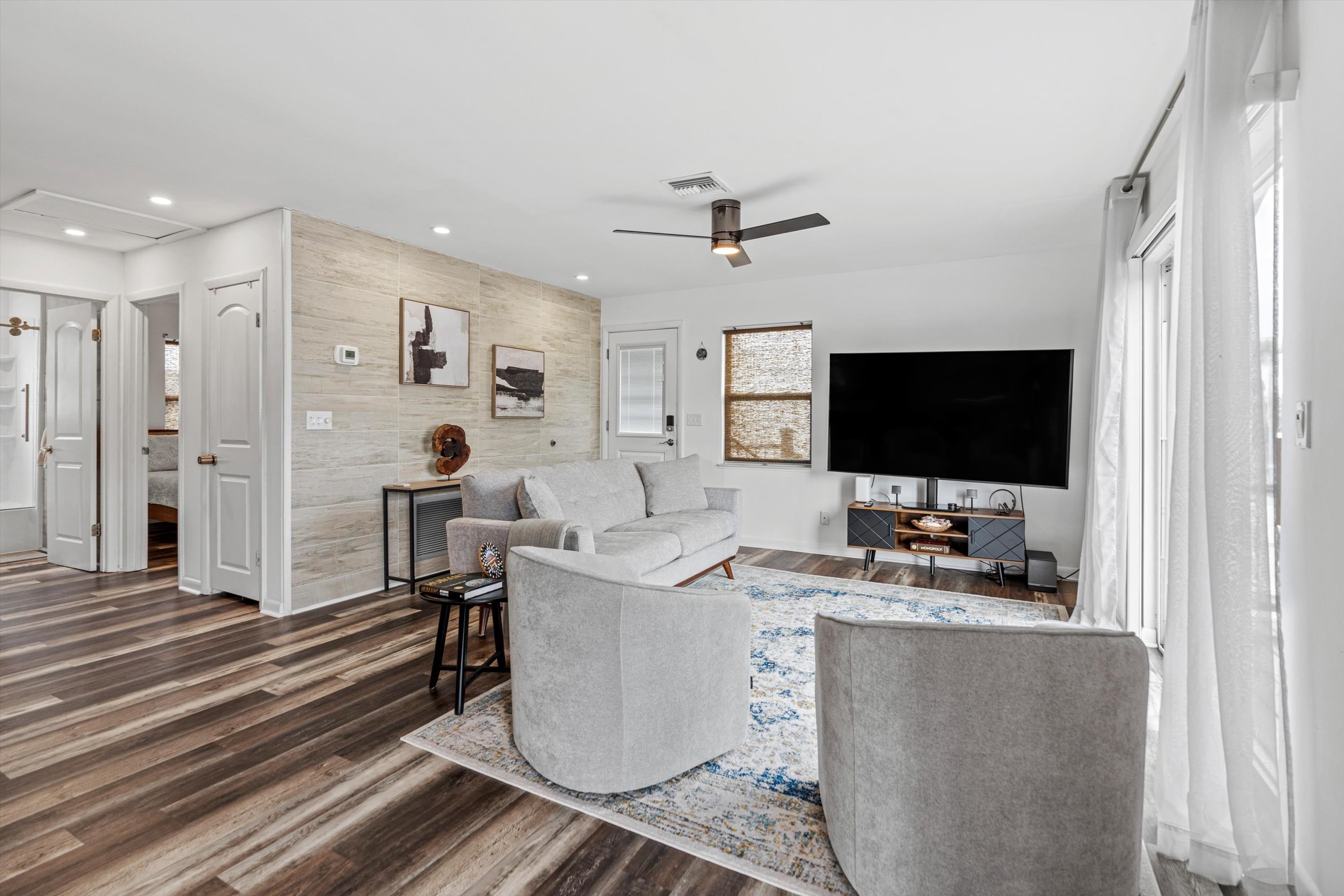 9 3rd Street, Unit UP St. Augustine, FL 32080 - Photo 12 of 24 a living room with furniture and a flat screen tv