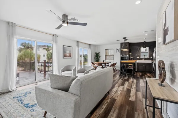 a bedroom with a bed and a flat tv screen on dresser