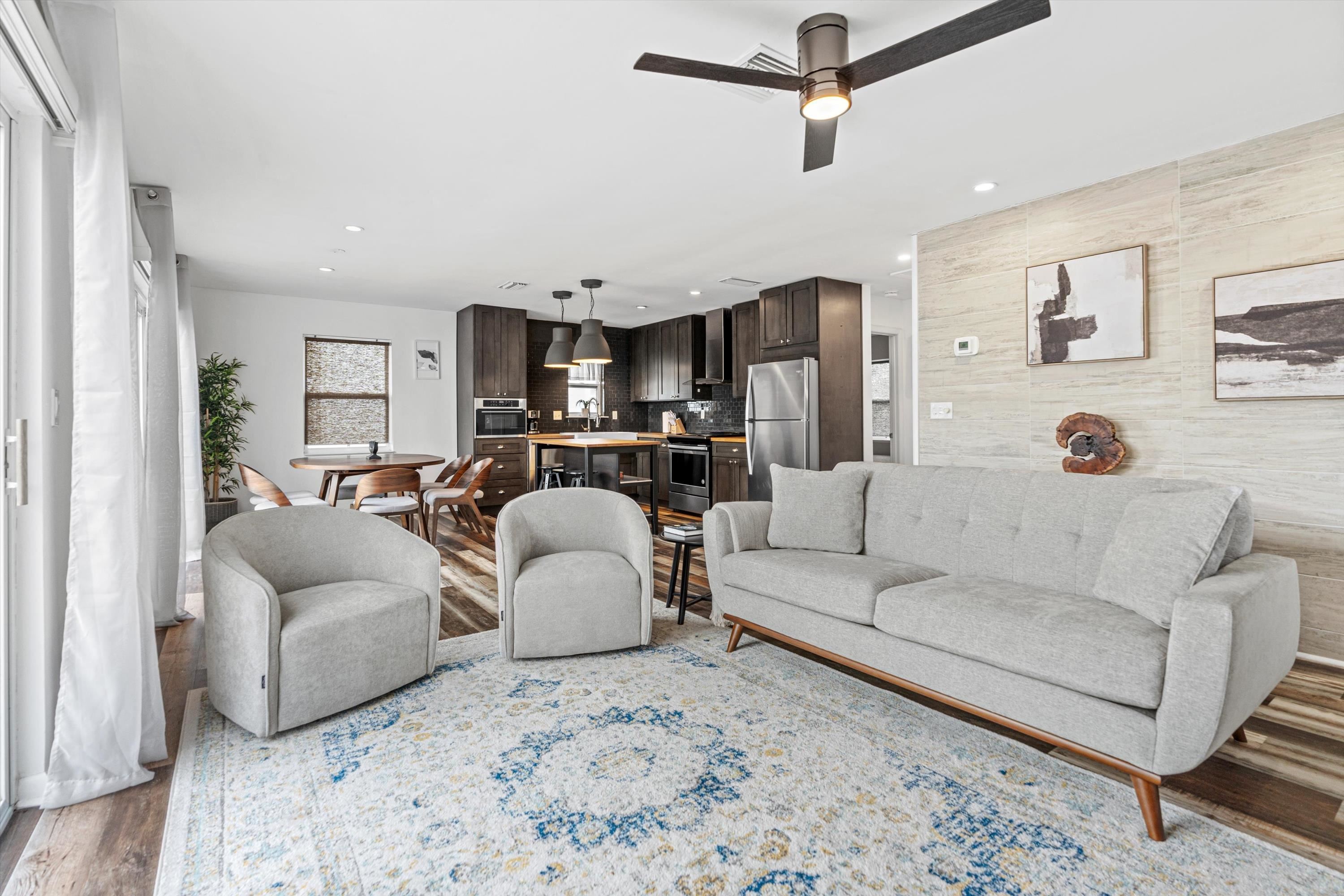 9 3rd Street, Unit UP St. Augustine, FL 32080 - Photo 14 of 24 a living room with furniture and a flat screen tv