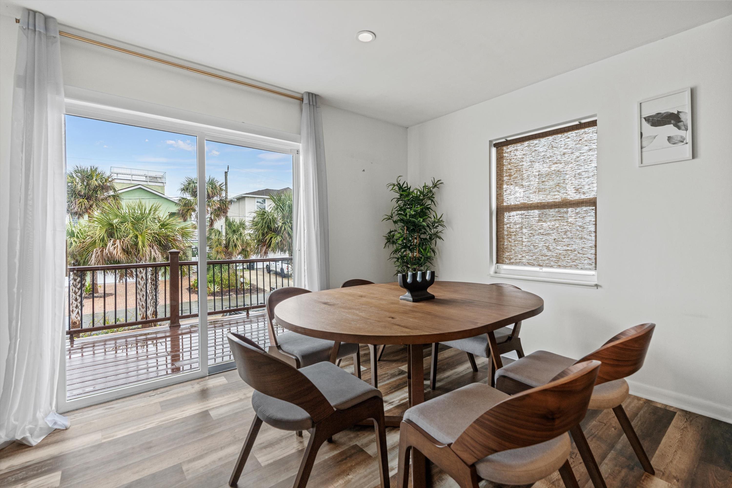 9 3rd Street, Unit UP St. Augustine, FL 32080 - Photo 15 of 24 a dining room with furniture and window