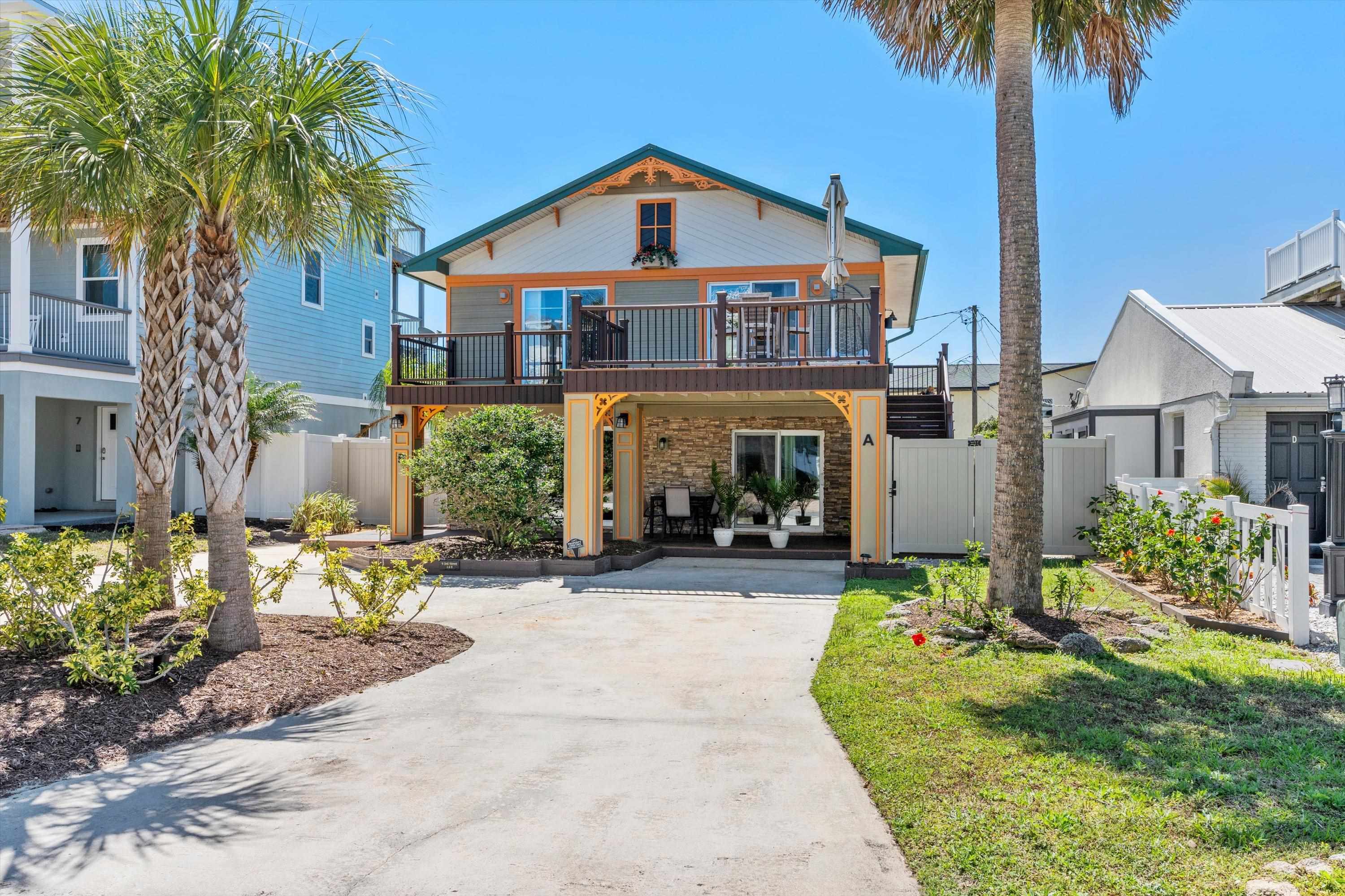 9 3rd Street, Unit UP St. Augustine, FL 32080 - Photo 2 of 24 a front view of a house with garden and porch