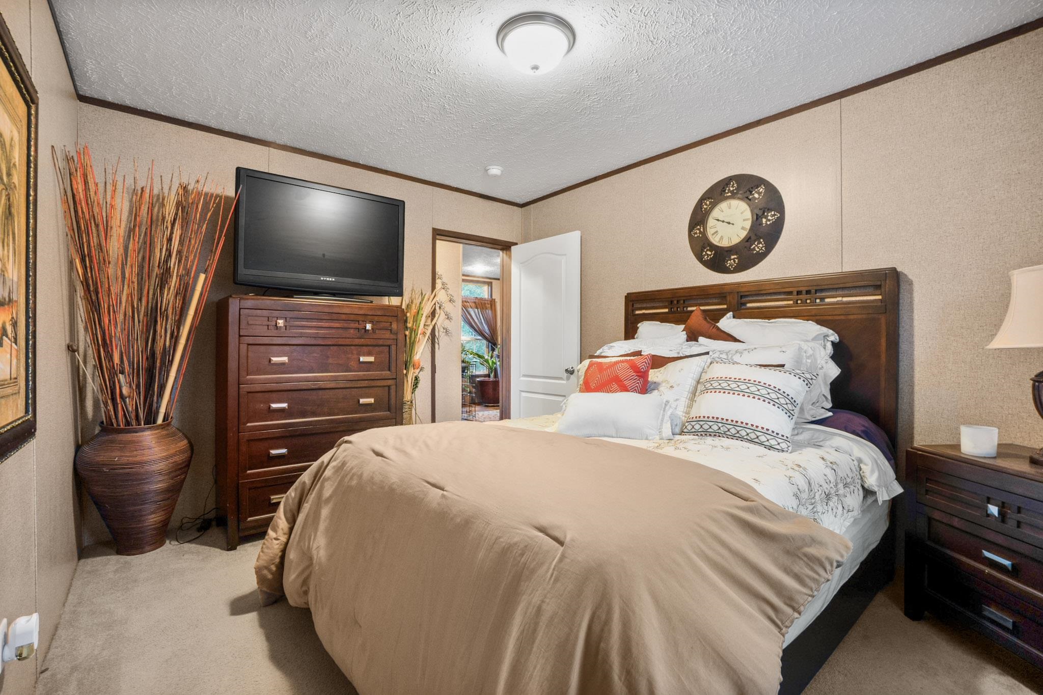3779 Dancyville Road Stanton, TN 38069 - Photo 16 of 40 a bedroom with a bed and a television