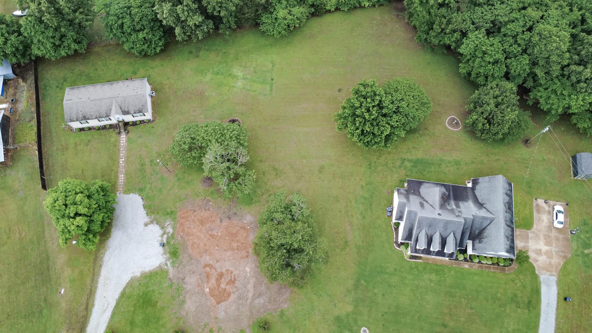 3779 Dancyville Road Stanton, TN 38069 - Photo 2 of 40 an aerial view of a house with outdoor space lake view and trees all around