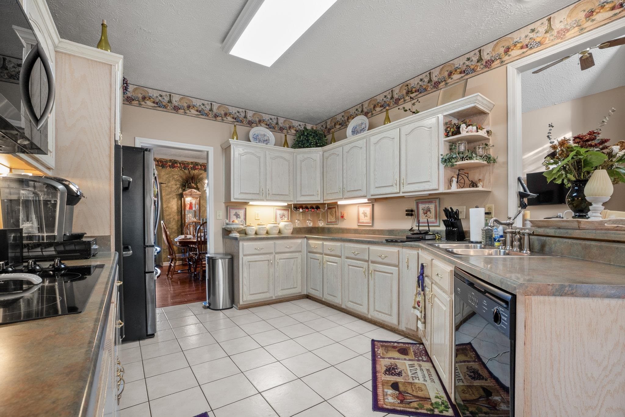 3779 Dancyville Road Stanton, TN 38069 - Photo 25 of 40 a kitchen with cabinets and chairs