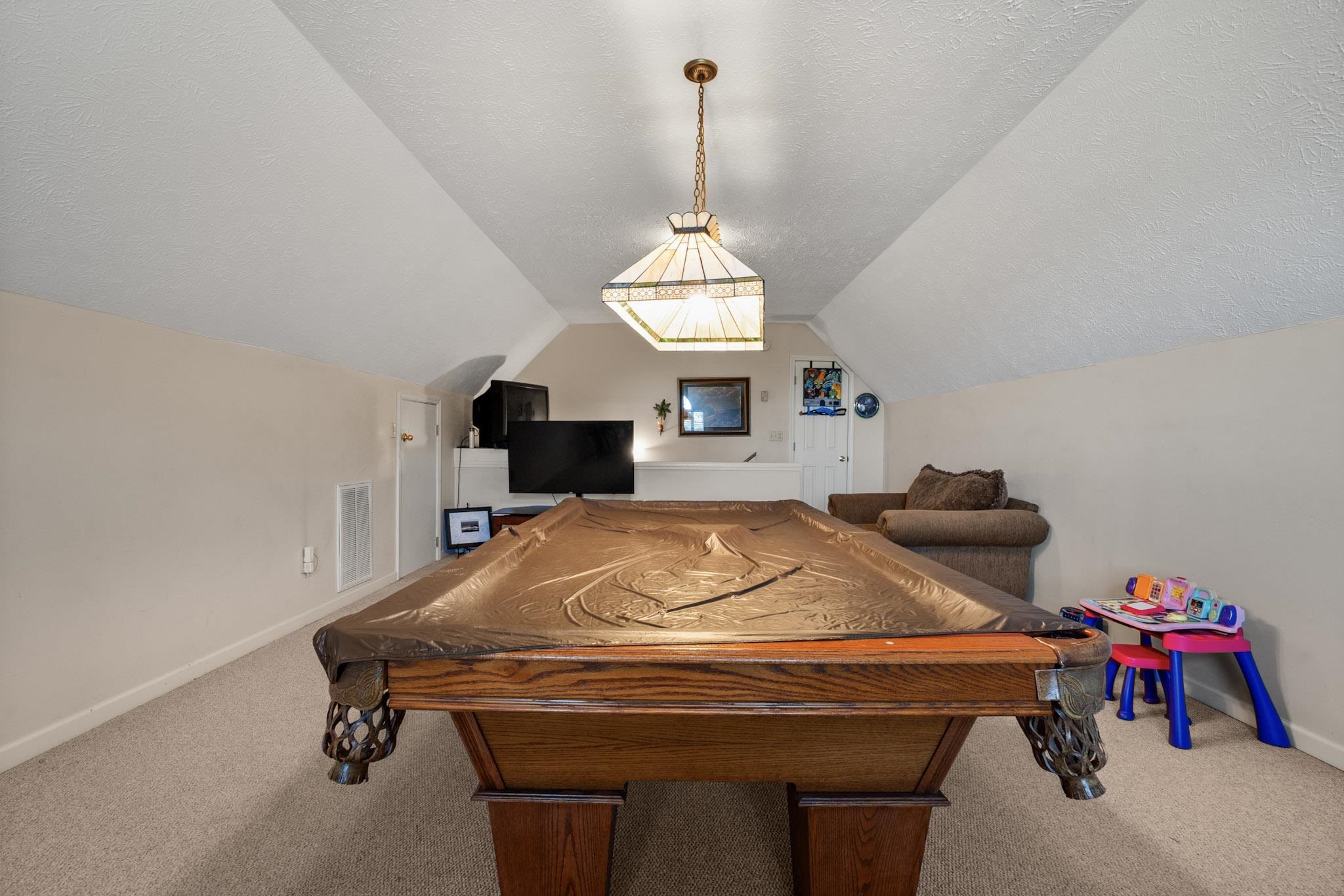 3779 Dancyville Road Stanton, TN 38069 - Photo 35 of 40 a room with a chandelier furniture and windows