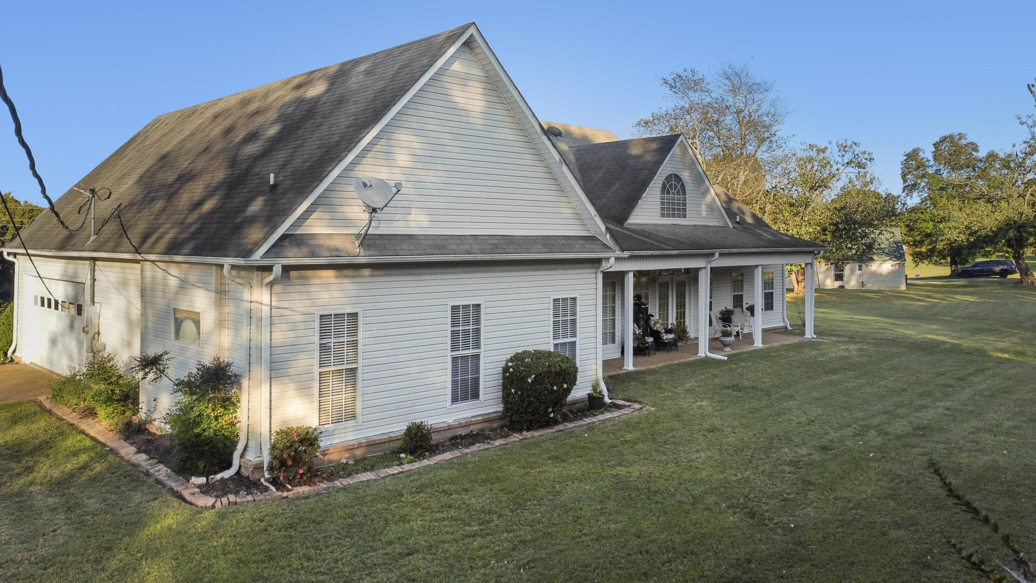 3779 Dancyville Road Stanton, TN 38069 - Photo 38 of 40 a view of a house with a yard