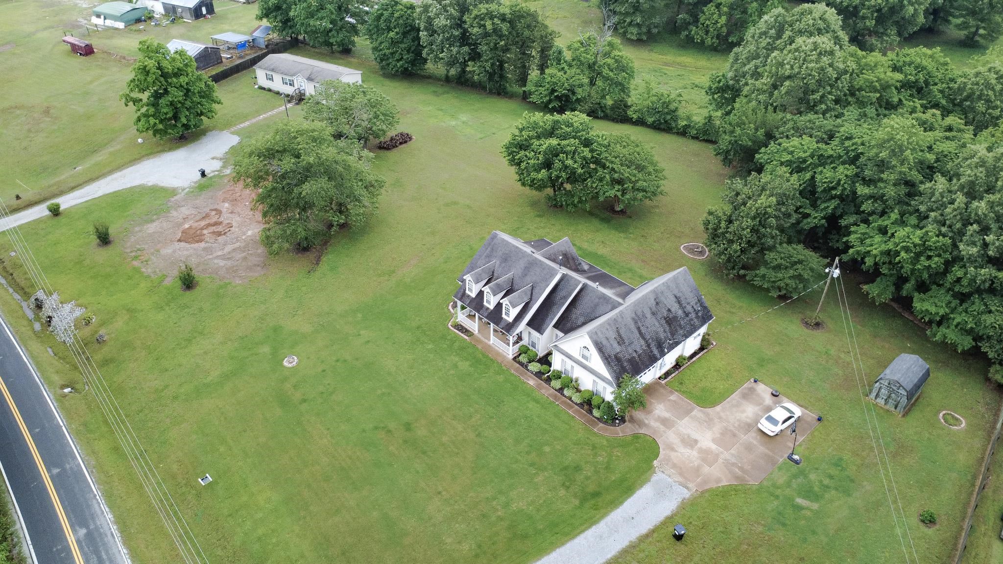 3779 Dancyville Road Stanton, TN 38069 - Photo 4 of 40 an aerial view of a house with garden space and street view