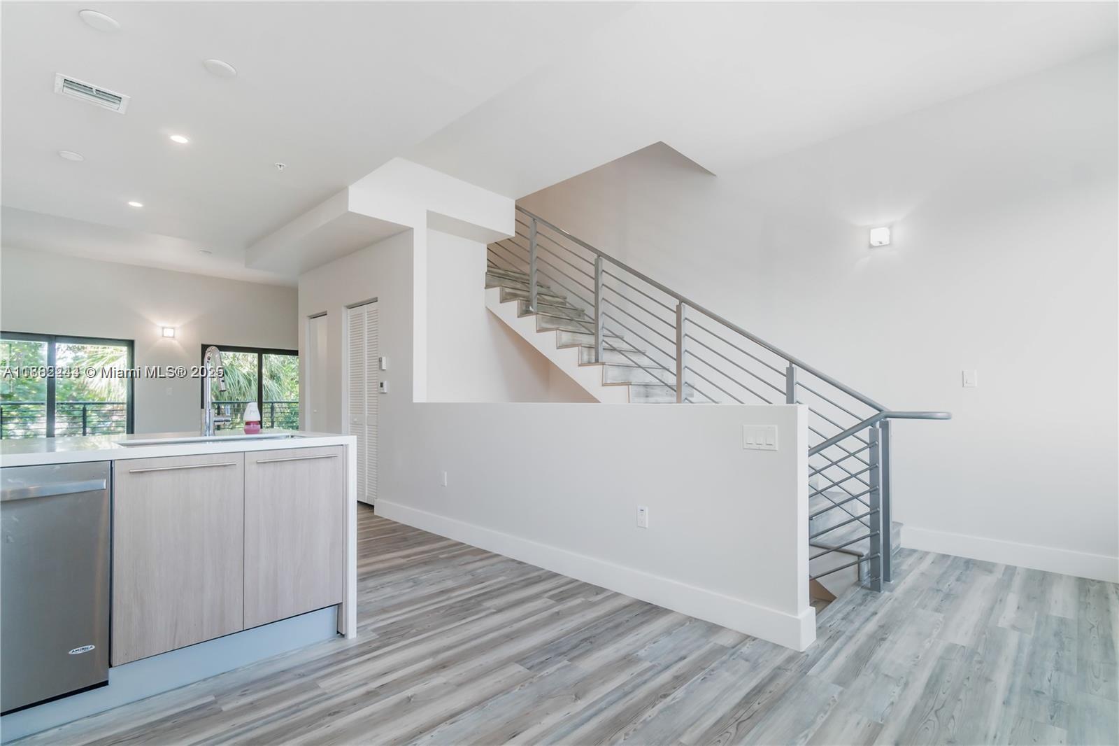 532 Southeast 1st Circle Pompano Beach, FL 33060 - Photo 13 of 57 a view of entryway and kitchen with wooden floor