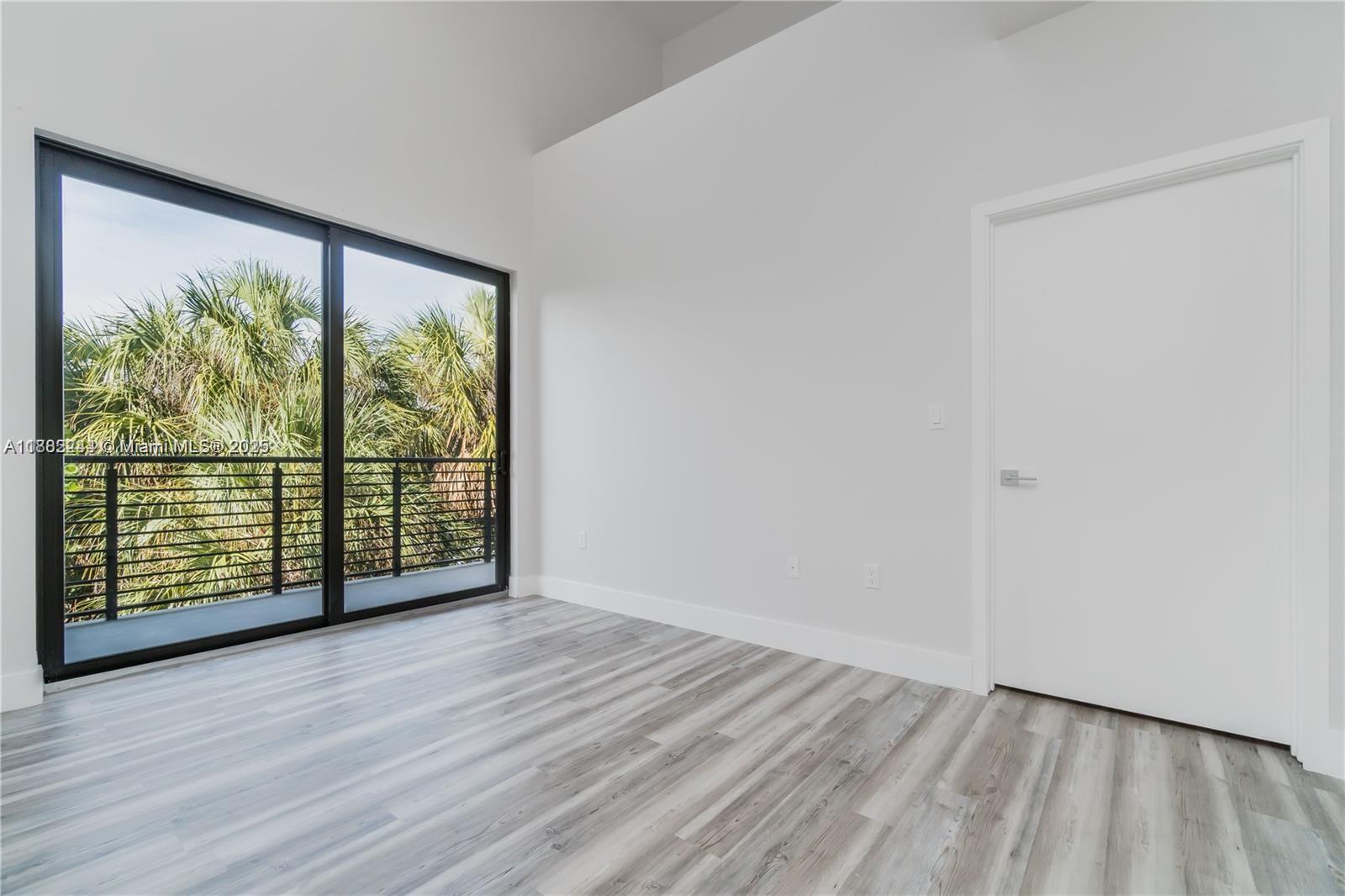 532 Southeast 1st Circle Pompano Beach, FL 33060 - Photo 20 of 57 wooden floor in an empty room with a window